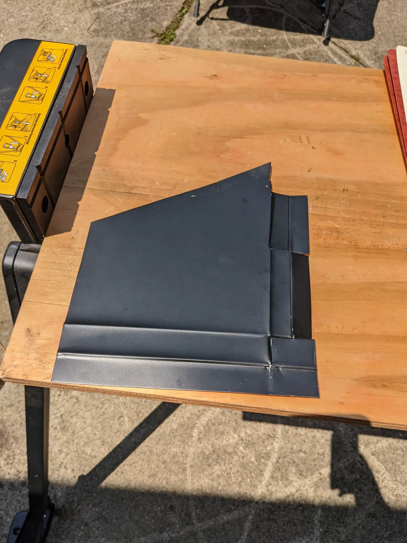 Single dark flashing test profile folded from aluminum coil.
