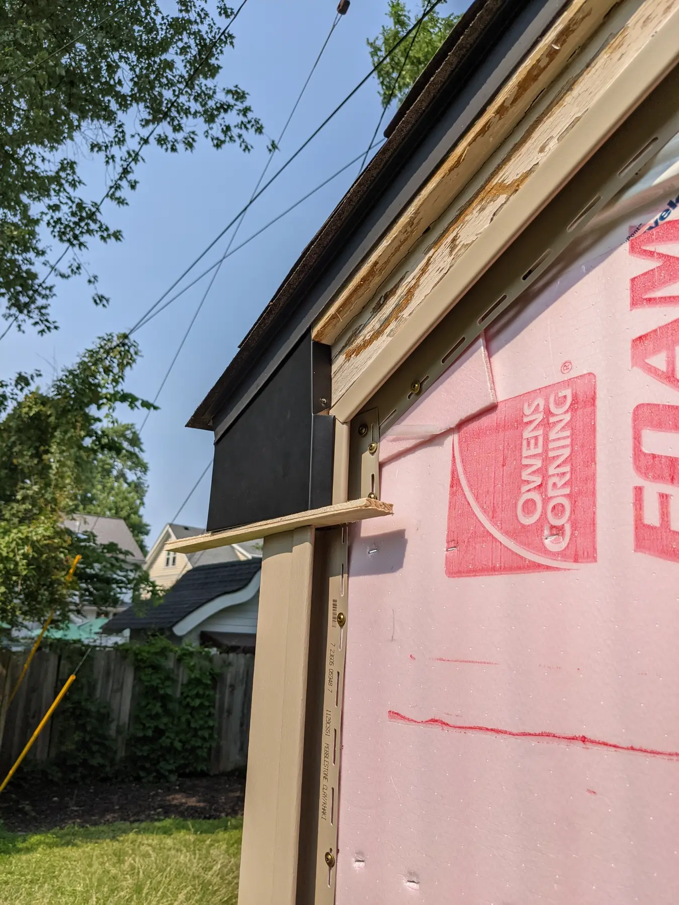 Installed flashing section beneath the roof edge.