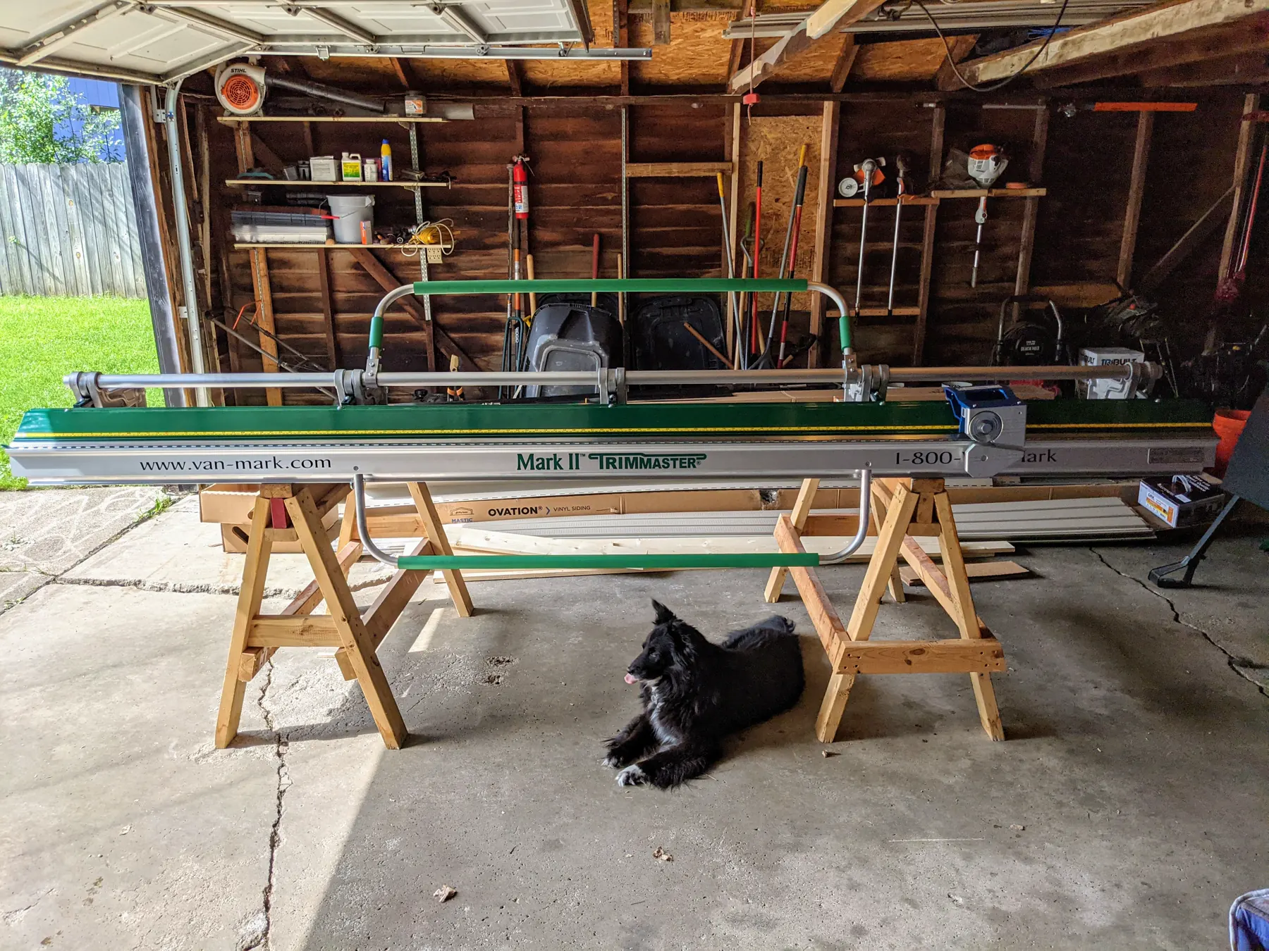 Van Mark Mark II Trimmaster sheet-metal brake set across sawhorses in the garage.