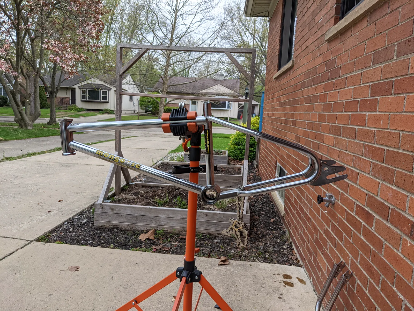 Bare Californian frame held on a work stand.