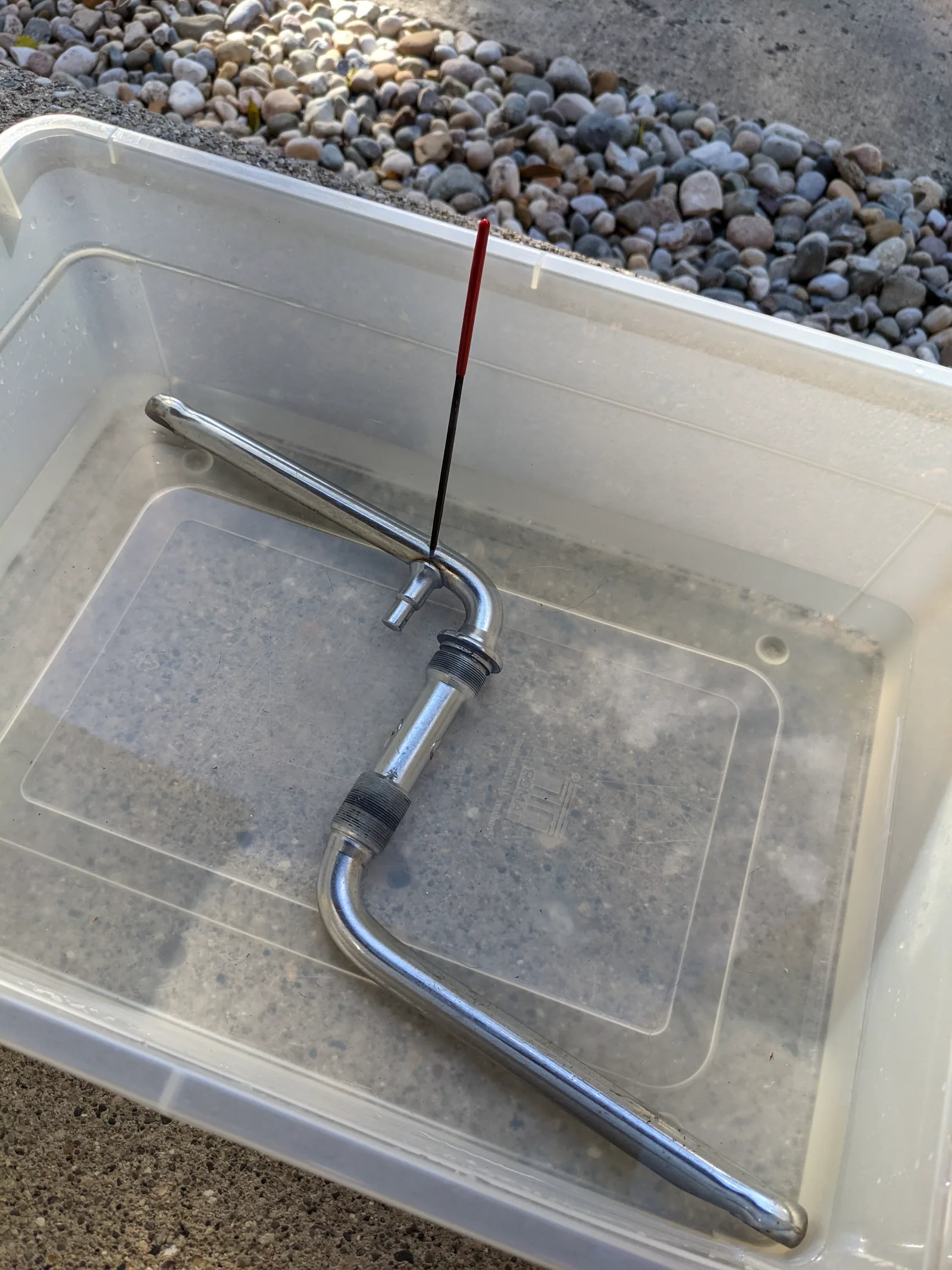 The one-piece crank soaking in a cleaning bath during the Power Plate replacement.