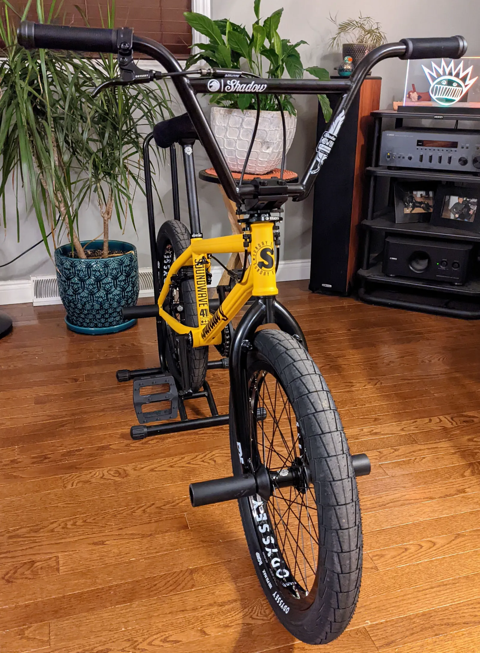 Front angle of the assembled yellow Sunday Soundwave showing its wide bars and front tire.