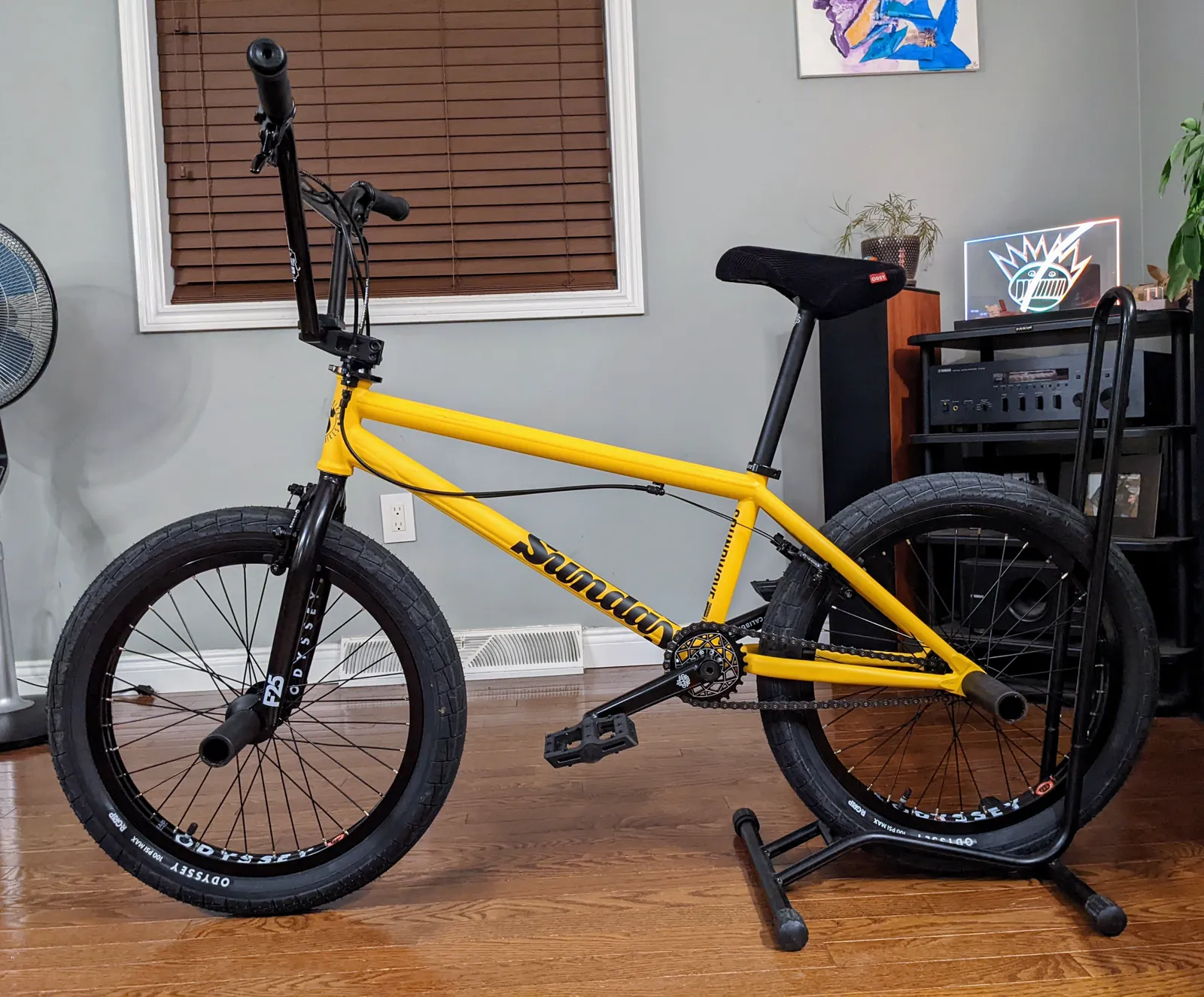 Final indoor side profile of the yellow-and-black Sunday Soundwave on a stand.
