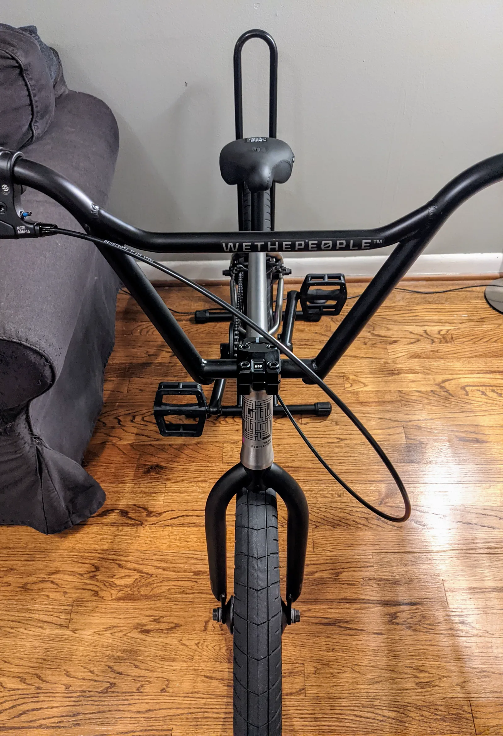 Rider-view alignment down the WTP handlebars, stem, fork, and front tire.