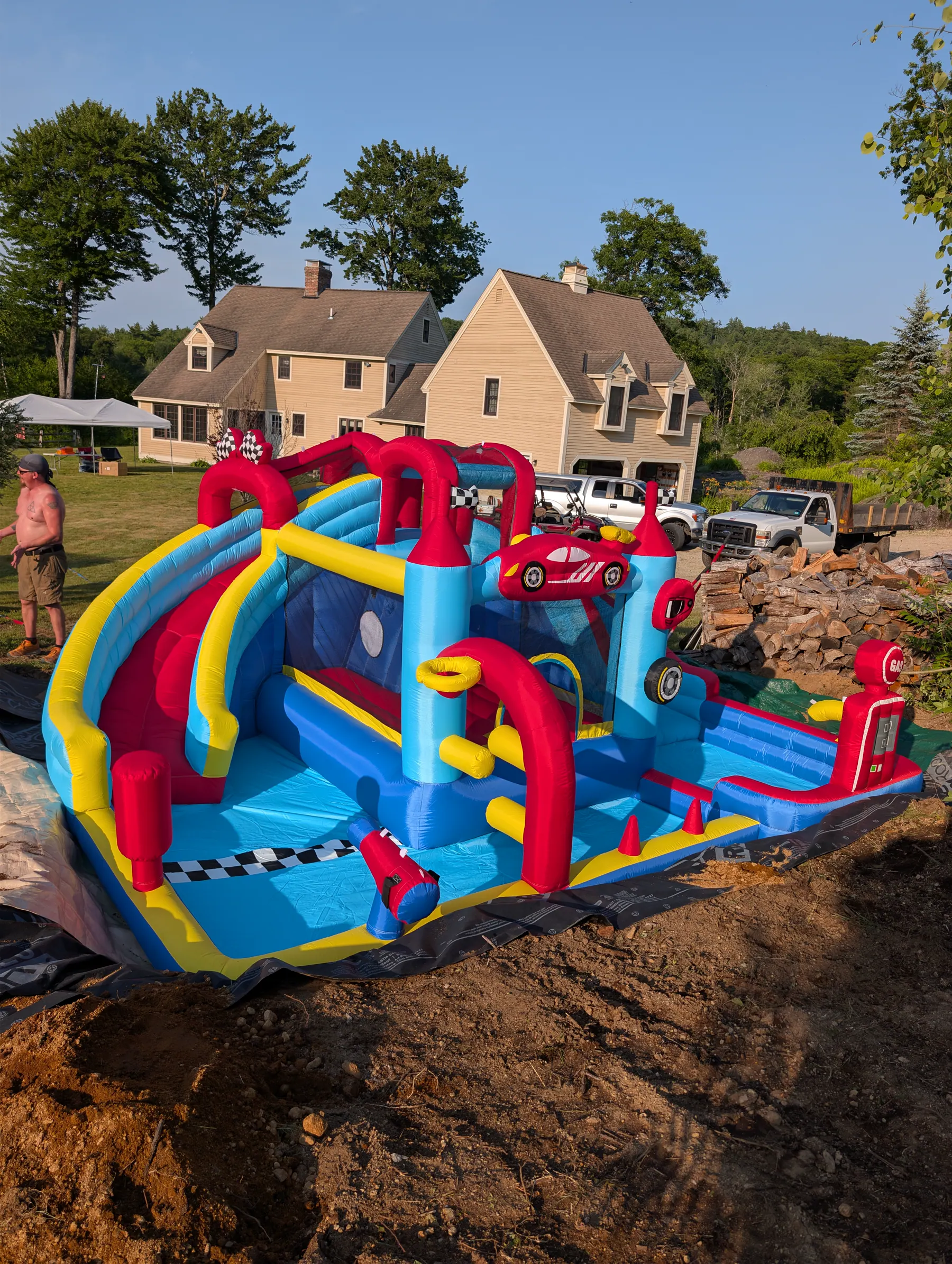 Water castle sitting below the surrounding disturbed grade in its excavated backyard recess.