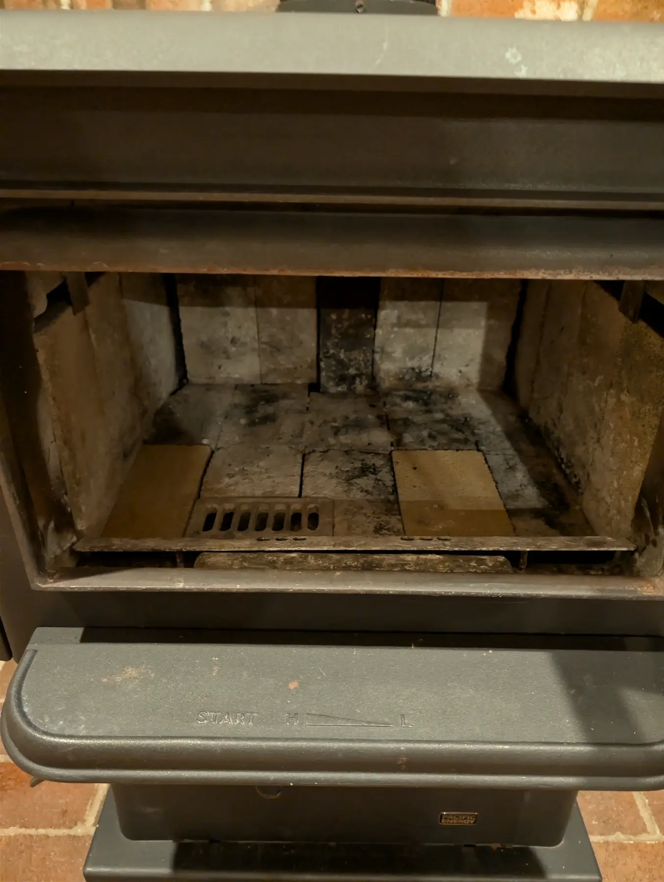 Open woodstove firebox checked before the first firing.